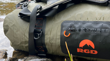 Fully waterproof duffel bag sitting in river